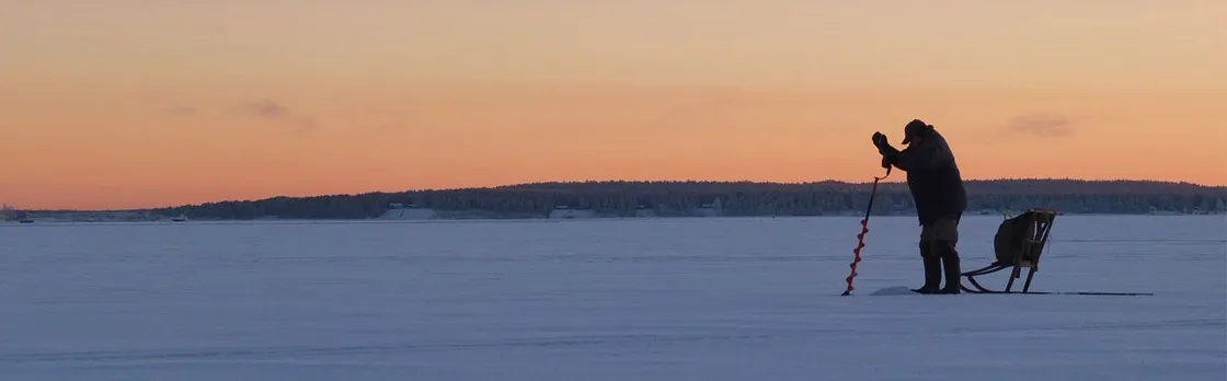 Guided ice fishing experience in Luleå