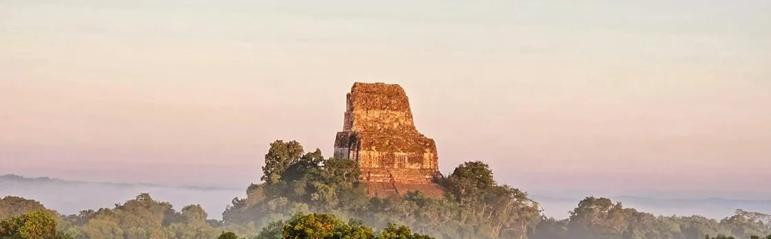 Explore ancient Maya temples on this Tikal sunset tour