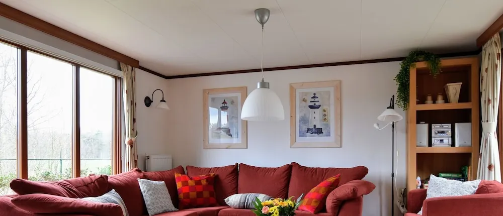 Chalet in Holiday Park With Spacious Living Room, Large Enclosed Garden and Unobstructed View