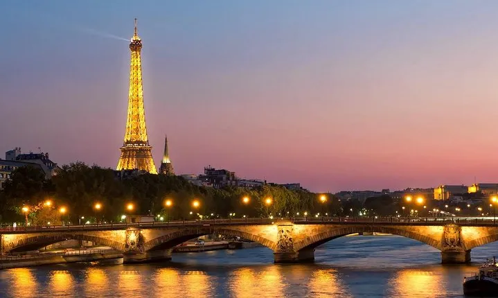 Paris By Night with Seine River Cruise and Roundtrip Luxury Transportation