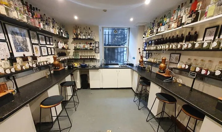 Distill a bottle of gin on mini copper stills