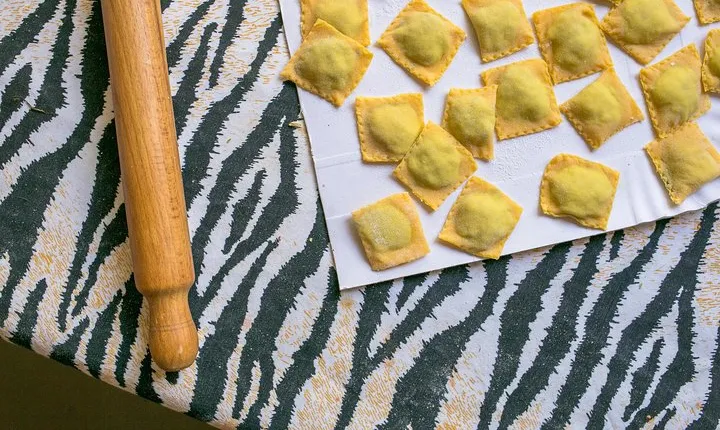 Local market visit and private cooking class at a Cesarina's home in Parma