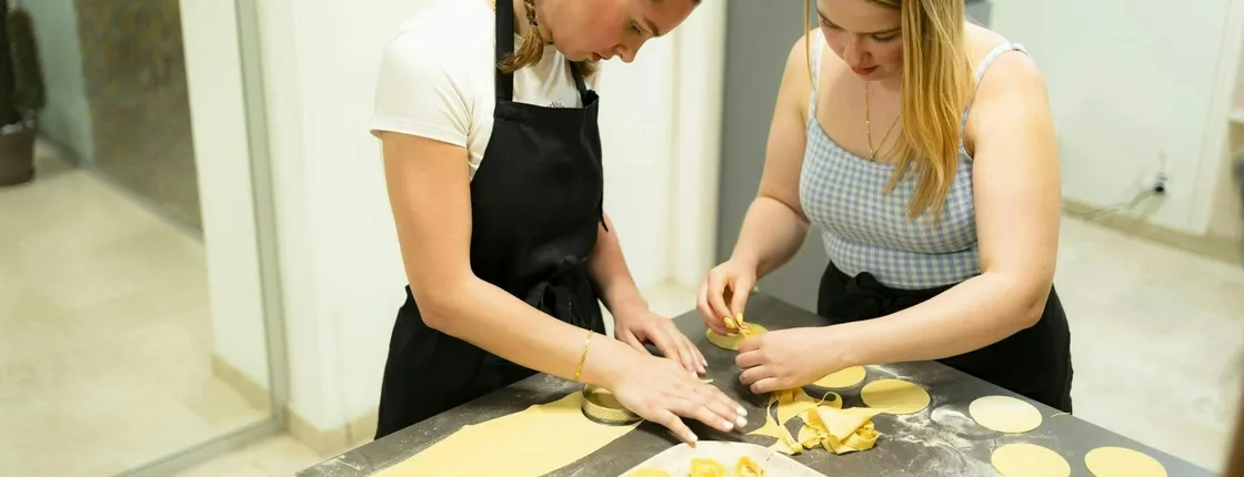 Fresh pasta and tiramisù cooking class with wine pairing in Milan