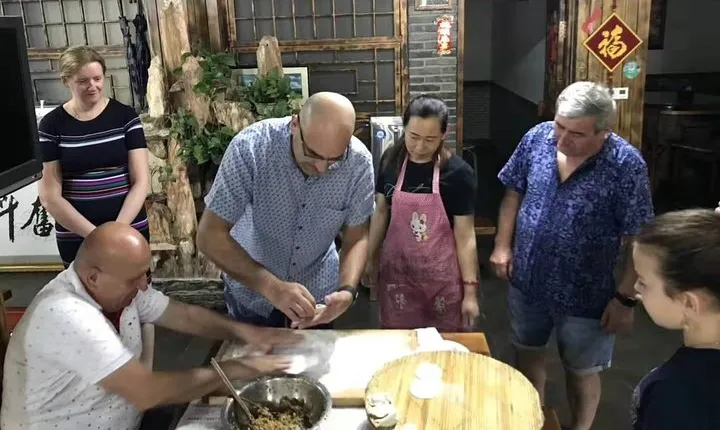 Beijing hutong rickshaw tour with homemade dumplings in family and Lama temple