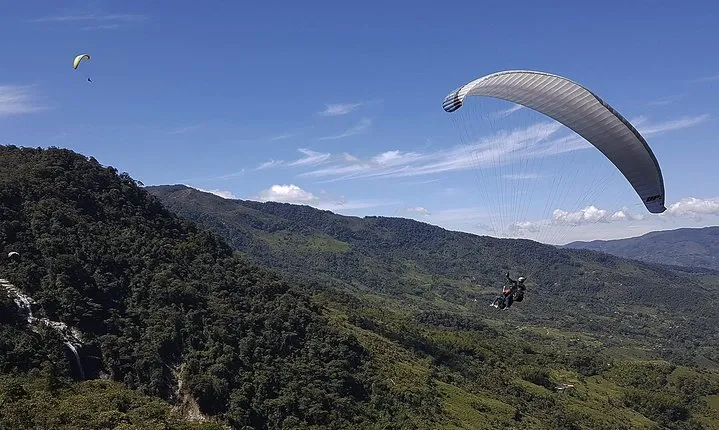 Fun RAFTING + Awesome PARAGLIDING over giant waterfalls from MEDELLIN