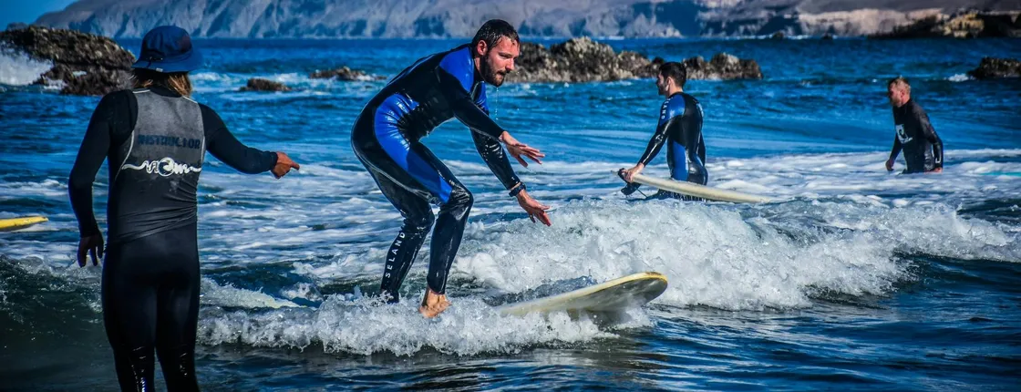 Surfing lessons in the south of Fuerteventura with transfers
