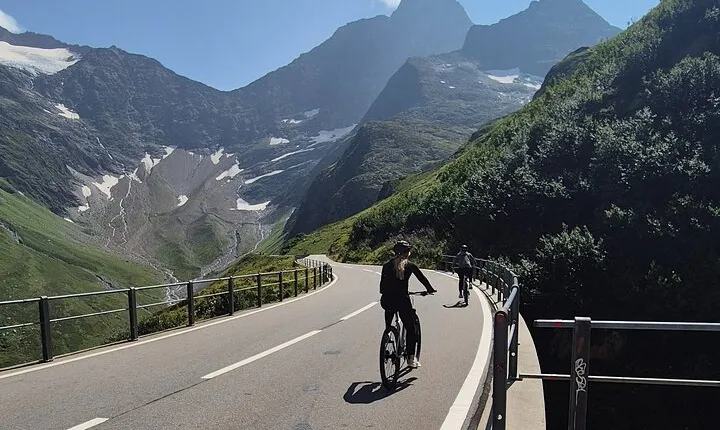 Alpine Pass Descent: Downhill Cycling Adventure in the Swiss Alps