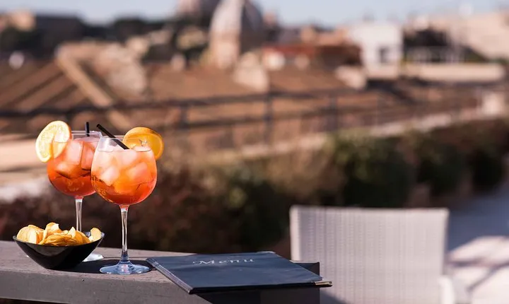 Sunset drinks on the rooftops of Rome