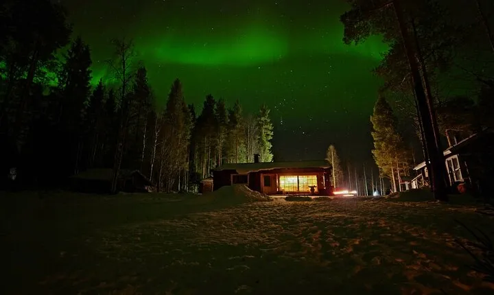 Northern Lights Hunting in Lappish old cottage