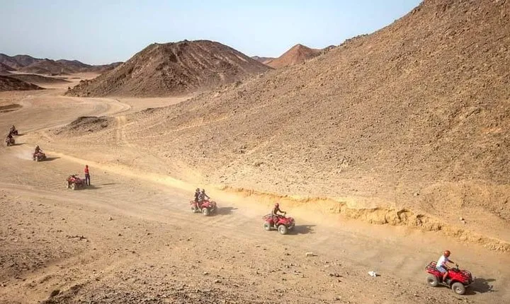 Sunset Desert Safari Trip by Quad Bike with Camel Ride and Bedouin Dinner 