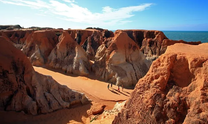 The colorful sands of Morro Branco beach - Full Day Tour