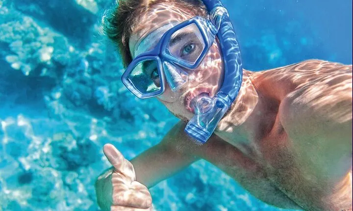 Arch Boat Tour and Snorkeling at Pelican Rock