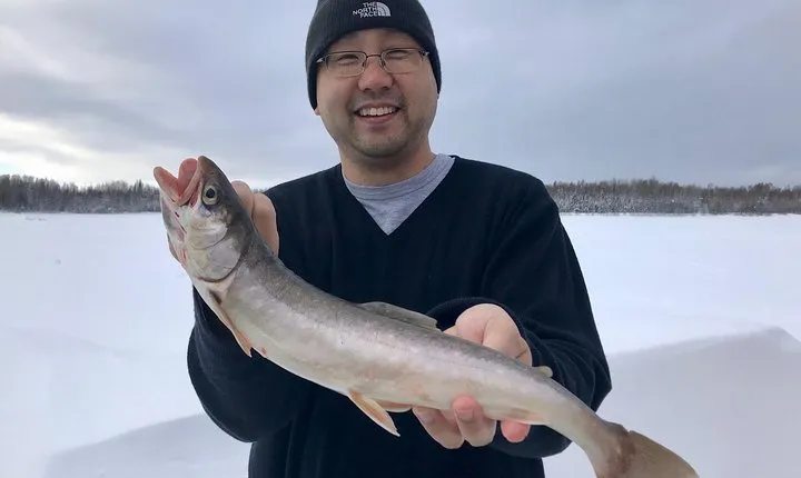 Fairbanks Ice Fishing Expedition in a Heated Cabin with Fish Cookout