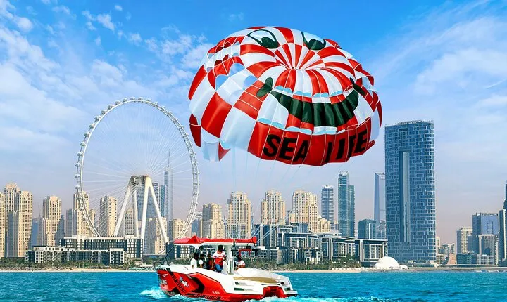 Parasailing in Dubai with Palm Jumeirah and JBR Beach views