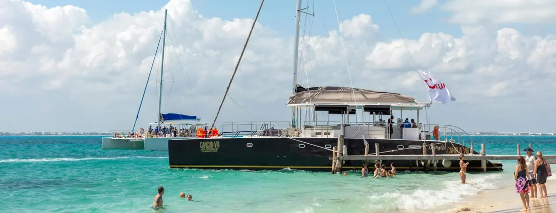 Catamaran cruise to Isla Mujeres with beach club visit and brunch