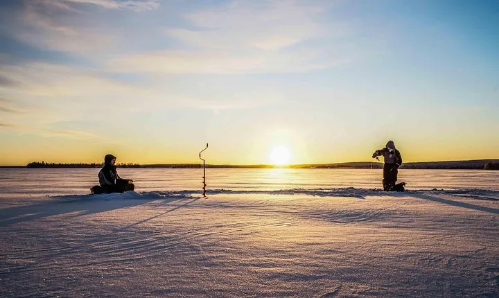 Ice fishing on a frozen lake