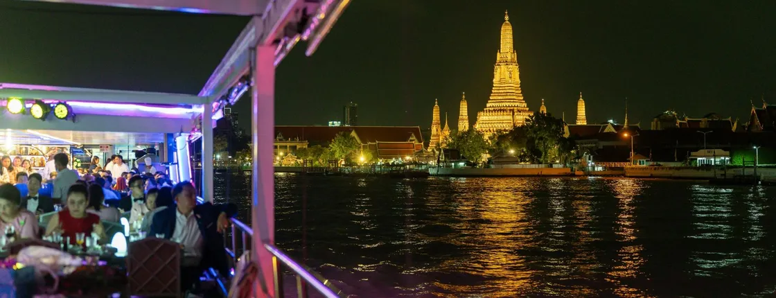 Evening dinner cruise on the Chao Phraya River with live shows and transfers