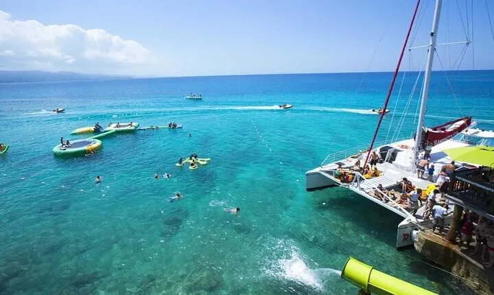 Bamboo Rafting & Catamaran Party Boat with Open Bar & Snorkeling