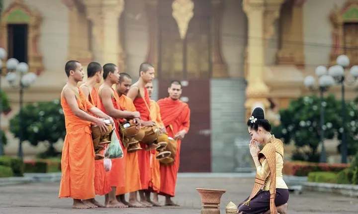Sunrise blessing walk towards famous temple with fruit and flower donation