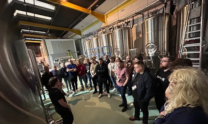 Brewery bus tour, 5 breweries, 12 beers, 1 pizza, 1 bus