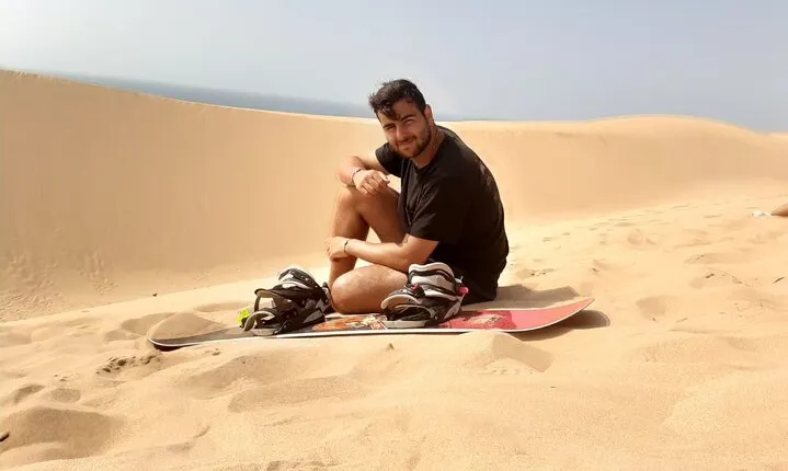Experience the sandboarding and painted village half day