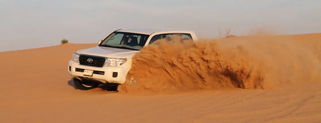 Desert safari with sandboarding and dinner from Dubai