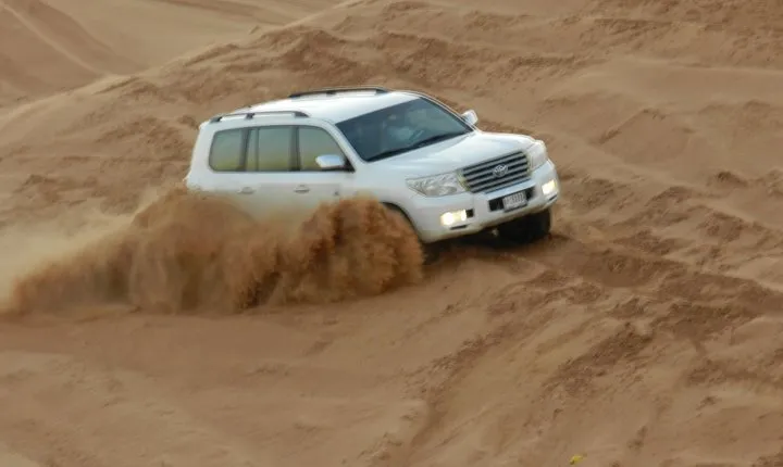 Morning Red Dunes Desert Safari With Camel Ride And Sand Boarding