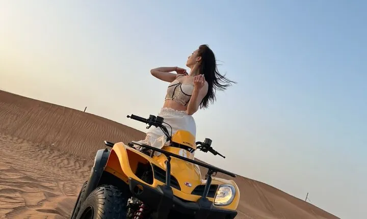 Dubai Desert Safari with Quad Bike, sandboarding, live show & BBQ