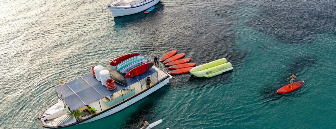 Boat tour with tapas, open bar and water sports in Ibiza