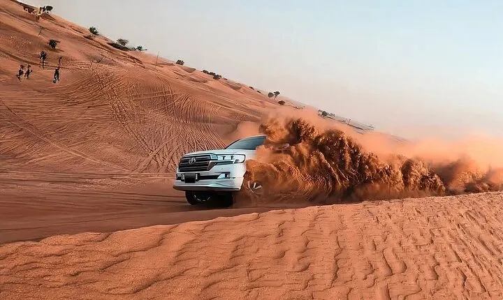 Evening Desert Adventure: Quad Biking, Sandboarding & Camel Ride