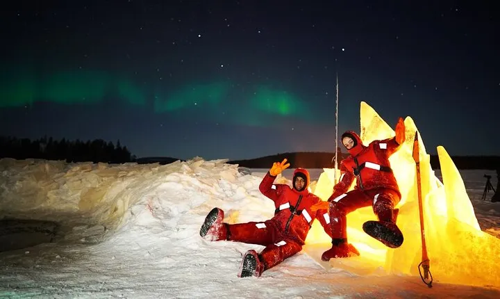 Ice Floating in Forest Lake with Aurora Borealis