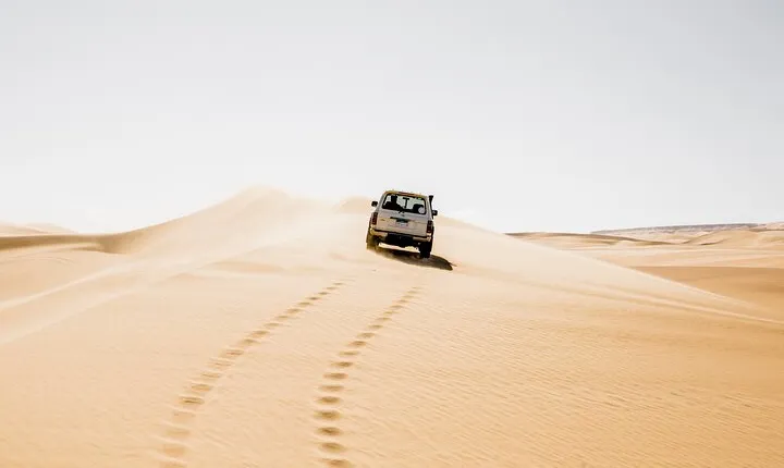 From Cairo: Desert Safari, Waterfalls, Sand boarding and Camel ride with Lunch