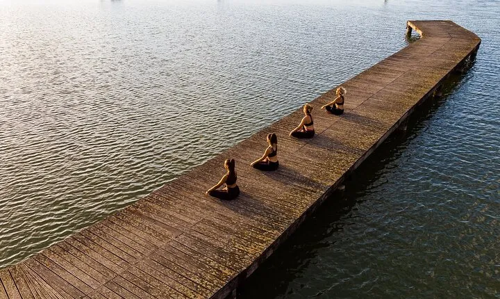 Relax and nature: Yoga lesson on the shore of the lake with picnic