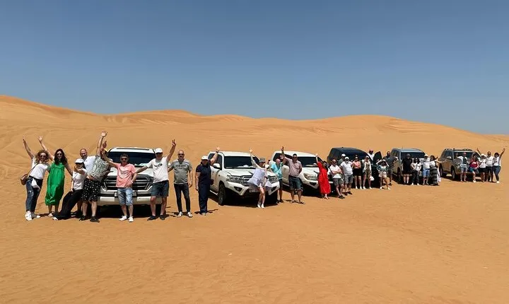 Abu Dhabi: 7-Hours Desert Safari with BBQ, Camel Ride & Sandboarding