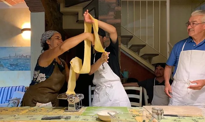 Traditional pasta rolling in an ancient Tuscan home