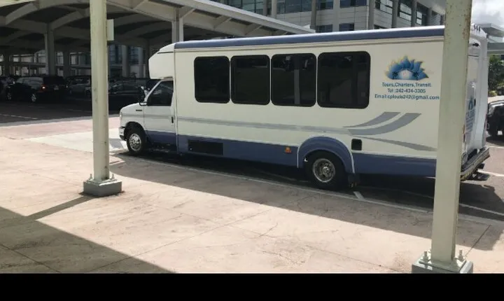 Coaches shuttle groups with luggages tag along