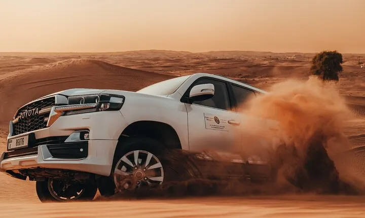 Deluxe Sunset Desert Safari: SandSurfing, Camel Ride & BBQ dinner