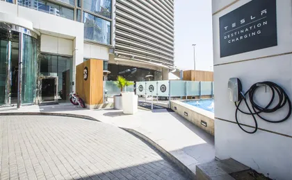 Entrance with Tesla charger at Media One Hotel