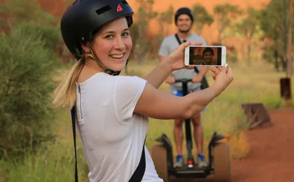 Quarter Uluru self-balancing scooter and sunset