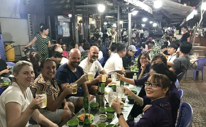 Ho Chi Minh City scooter food tour by night with a local host