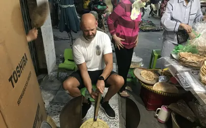 Ho Chi Minh City scooter food tour by night with a local host