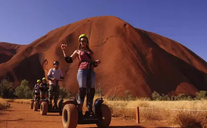 Quarter Uluru self-balancing scooter and sunset